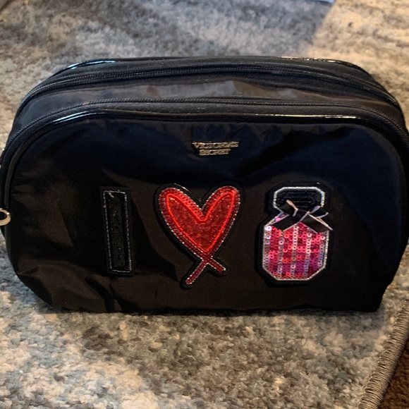 Victoria's Secret Handbags - Victoria's Secret Black Travel Bag with Red and Pink Accents